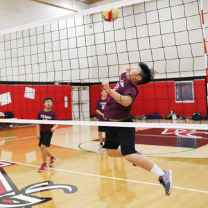 Student Playing Volleyball